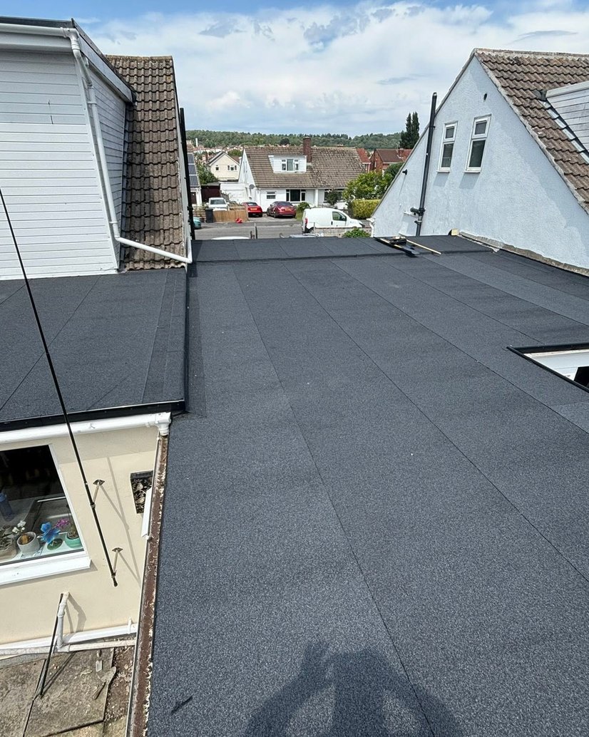 Finished felt flat roof spanning the rear of adjoining homes