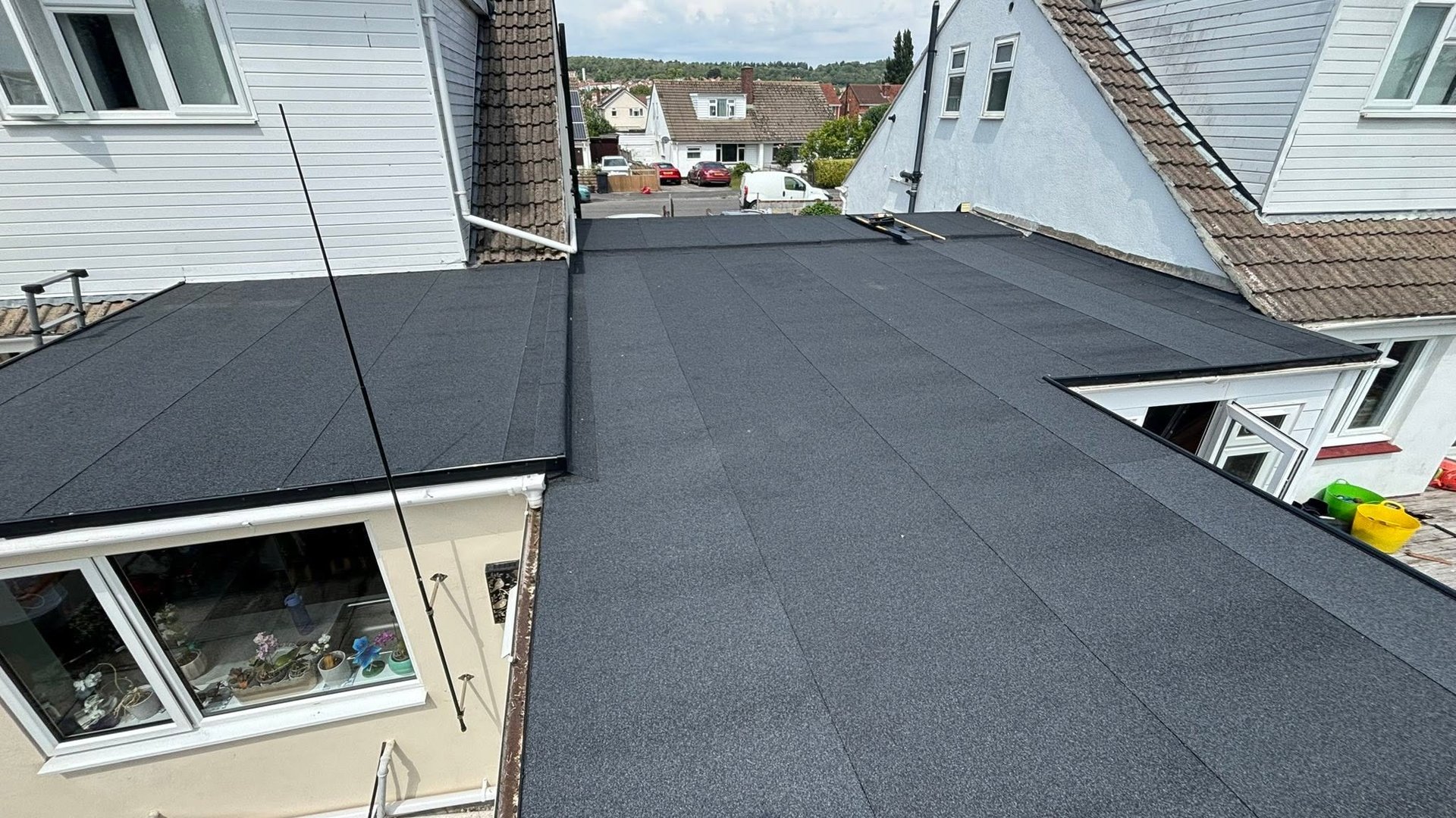 Finished flat roof spanning adjoining homes